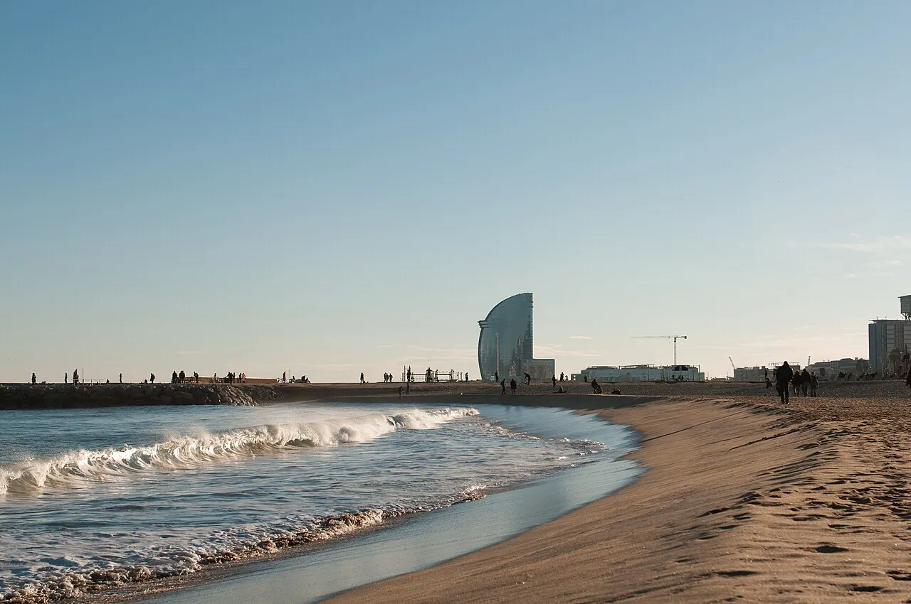 The beach at Barcelona on a sunny day. Using this image is free, as long as you refer to